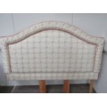 An upholstered and padded headboard, double bed size, green lattice and floral pattern with two