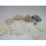 A small box contaning six early Victorian baby bonnets and two bibs