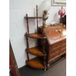 A walnut and marquetry four-tier corner whatnot with turned supports and urn detailing, 145cm high