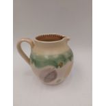 A Susie Cooper studio ceramic jug painted with chestnut motifs. Painted signature and No. M66.V.