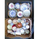 A box containing mostly assorted cups and saucers and a box of dinner plates, saucers and dishes,