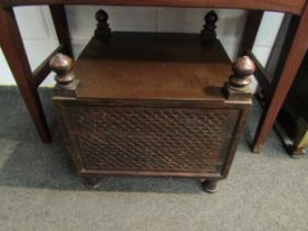A carved wood storage box with finial detail containing a framed bygone photograph of horse and cart