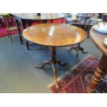 A Georgian country oak wine table, turned column to tripod base. 67cm high x 70cm diameter