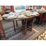 A 20th Century oak gateleg dining table, with D-shaped drop leaves