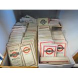 Two shoe boxes containing vintage London Route Guides and London bus maps from the 30's, 40's, 50's,