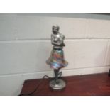 A 1920's style Brevette cast alloy lamp of a semi-clad lady with iridescent shade as a skirt, 36cm