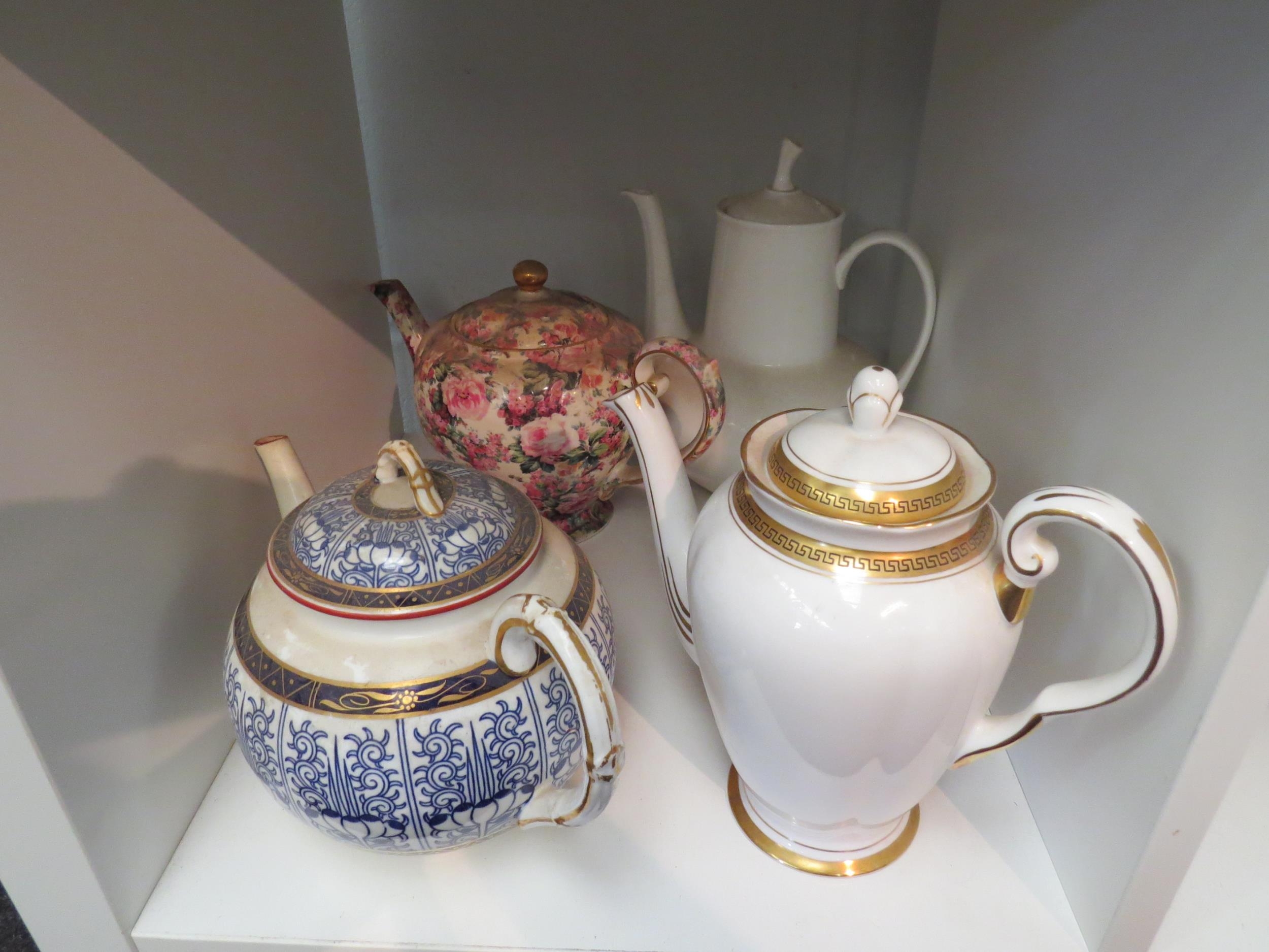 Two teapots and two coffee pots, Worcester, Royal Tuscan, Arthur Woods "Chintz" example (4)
