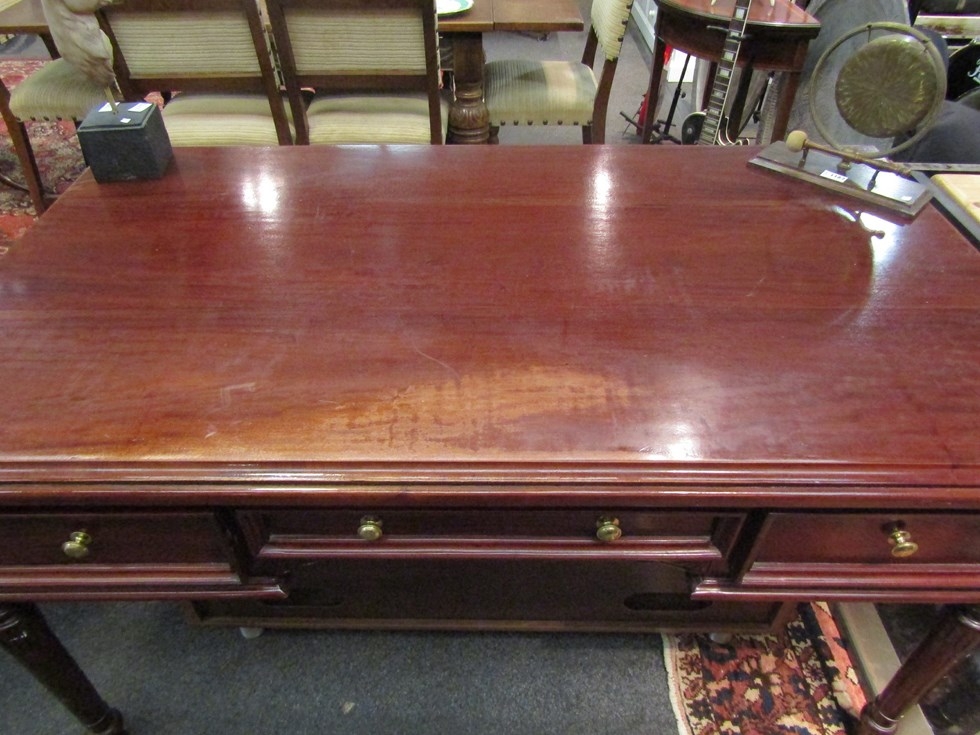 A Victorian style writing table of three faux and three frieze drawers on turned and carved legs. - Image 2 of 3
