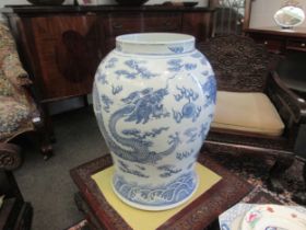 A Chinese blue and white urn of large proportions, restored. 51cm height.