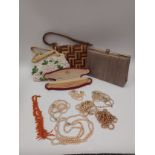 A jewellery box with contents including rings, earrings, brooches, faux pearl necklaces, with two