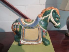 An ornamental ceramic horse. 47cm length