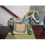 An ornamental ceramic horse. 47cm length