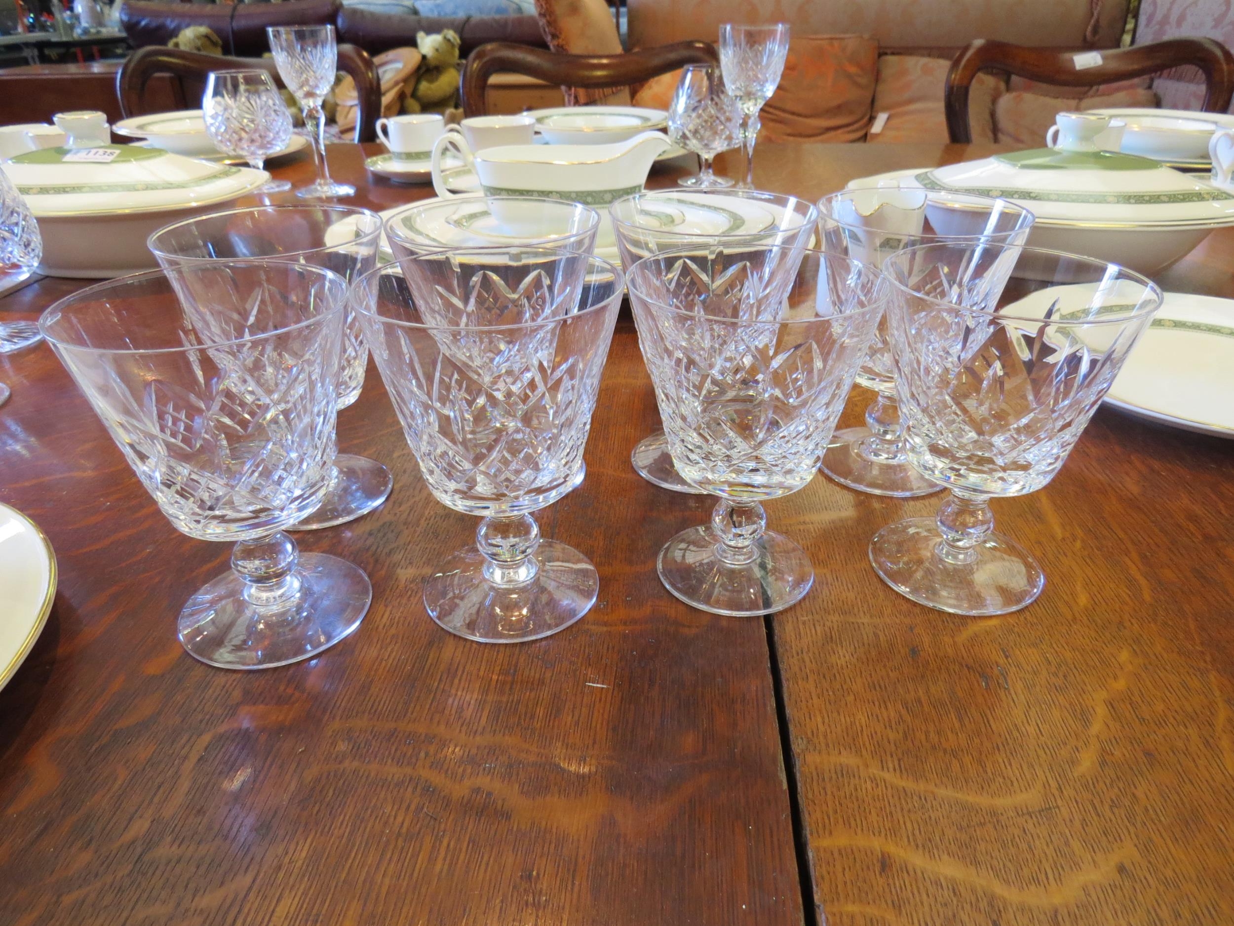 Eight water glasses on ball knopped stems