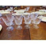 Eight water glasses on ball knopped stems
