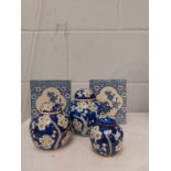 A pair of Oriental blue and white flower incense holders and a set of three Oriental ginger jars