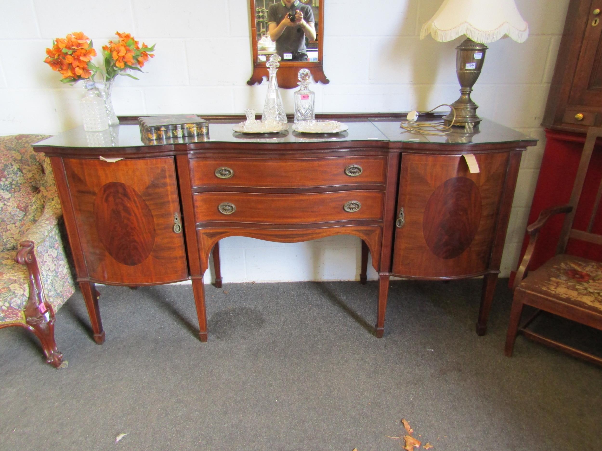 An Edwardian crossbanded mahogany serpentine fronted sideboard in the 18th Century style (back