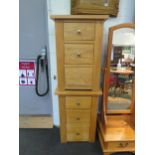 A pair of oak three drawer bedside chests,, 76cm high x 54cm wide x 36cm deep