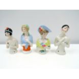 Four early 20th Century glazed china half-dolls including Pierrette, tallest 9cm tall