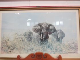 A David Shepherd print, "Three Happy Jumbos", signed in pencil, framed and glazed, 45cm x 84cm