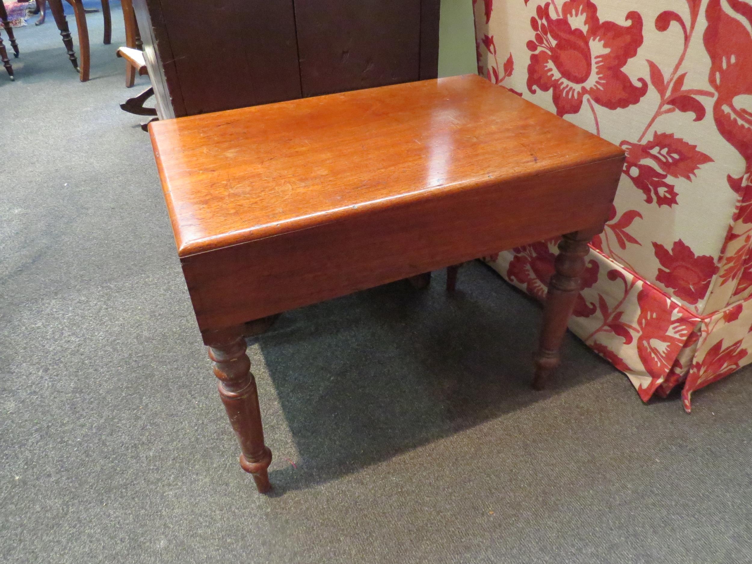 A Victorian mahogany bidet with ceramic liner