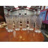 Five tall crystal glasses