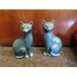 A pair of Poole pottery cats, 17cm high