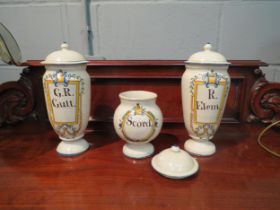 Three Spanish faience drug jars: Scord, G R Gutt and R Elem. Various chips, restored, tallest 30cm
