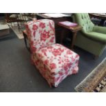 A Nina Campbell slipper chair with floral design