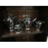 An Old Hall stainless steel four piece tea set