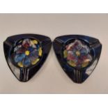 Two Moorcroft ashtrays decorated with a central flower