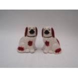 A small pair of red and white Staffordshire dogs 10cm high