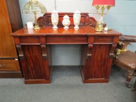 A mahogany sideboard with three drawers and wine cupboard within pedestal, 117cm high x 153cm wide x