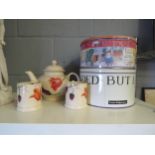 An Emma Bridgewater "Tulips" design teapot and a pair of tea cups, together with two cake tins (5)