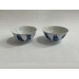 Two Chinese blue and white bowls, figural design, character mark to base, each approximately 14cm