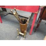 A copper umbrella stand with handle together with brass fireside accompanyments and a pair of fire