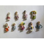 Nine glazed china half dolls and pin cushions, including balloon holding, tallest 6cm