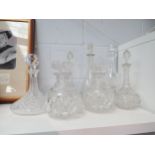 A collection of seven Victorian and later crystal and cut glass decanters including two pairs, a/
