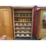 A stripped pine bookshelf with six shelves, 198cm high x 120cm wide x 33cm deep