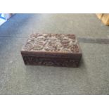 A 20th Century Oriental carved box with dragon and crown design
