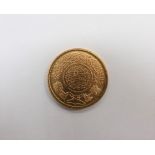 A Saudi Arabia gold Guinea trade coin, 22ct.