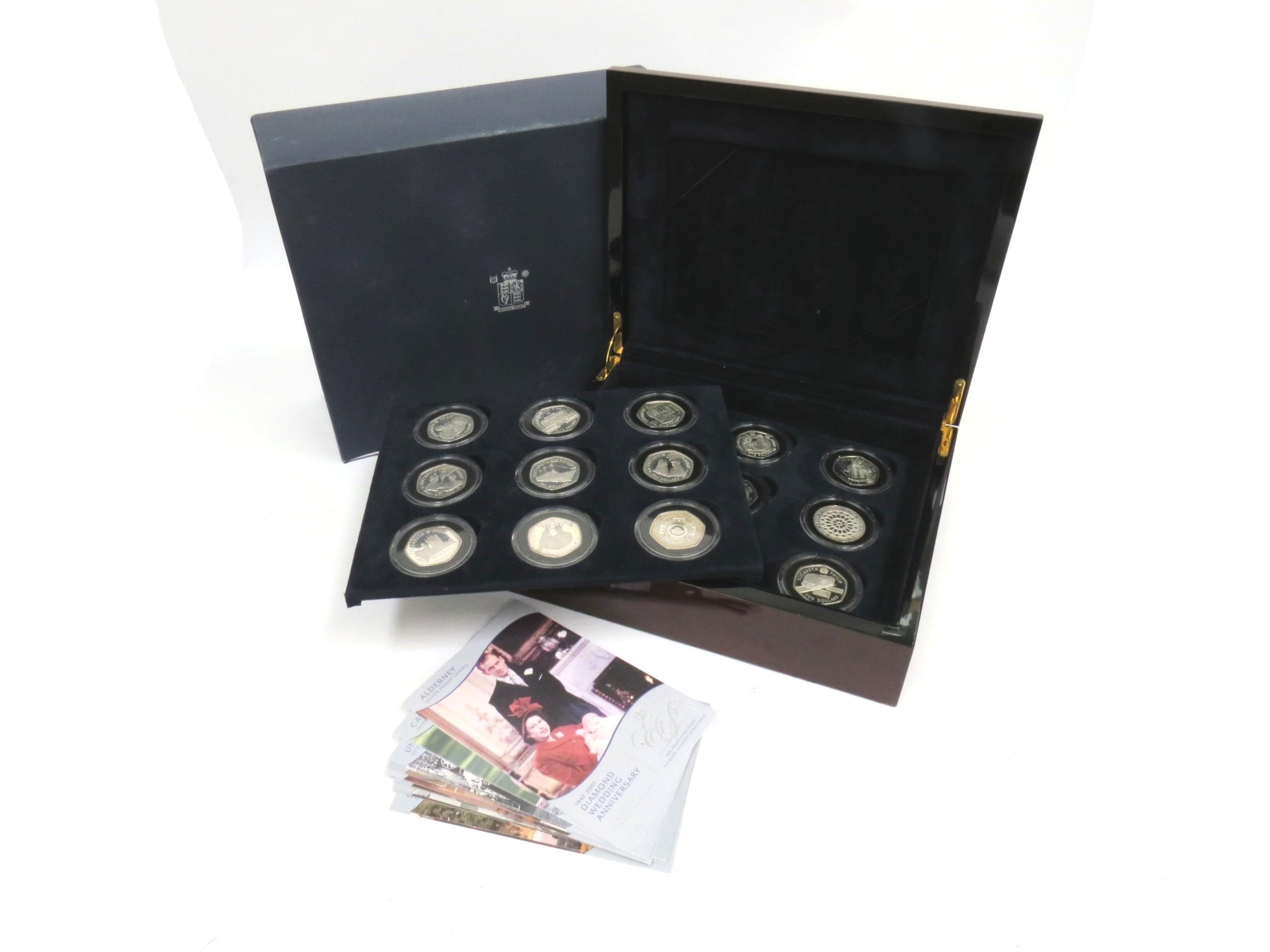 A Royal Mint "Diamond Wedding Anniversary" silver proof crown set of 18 hexagonal dollar and five