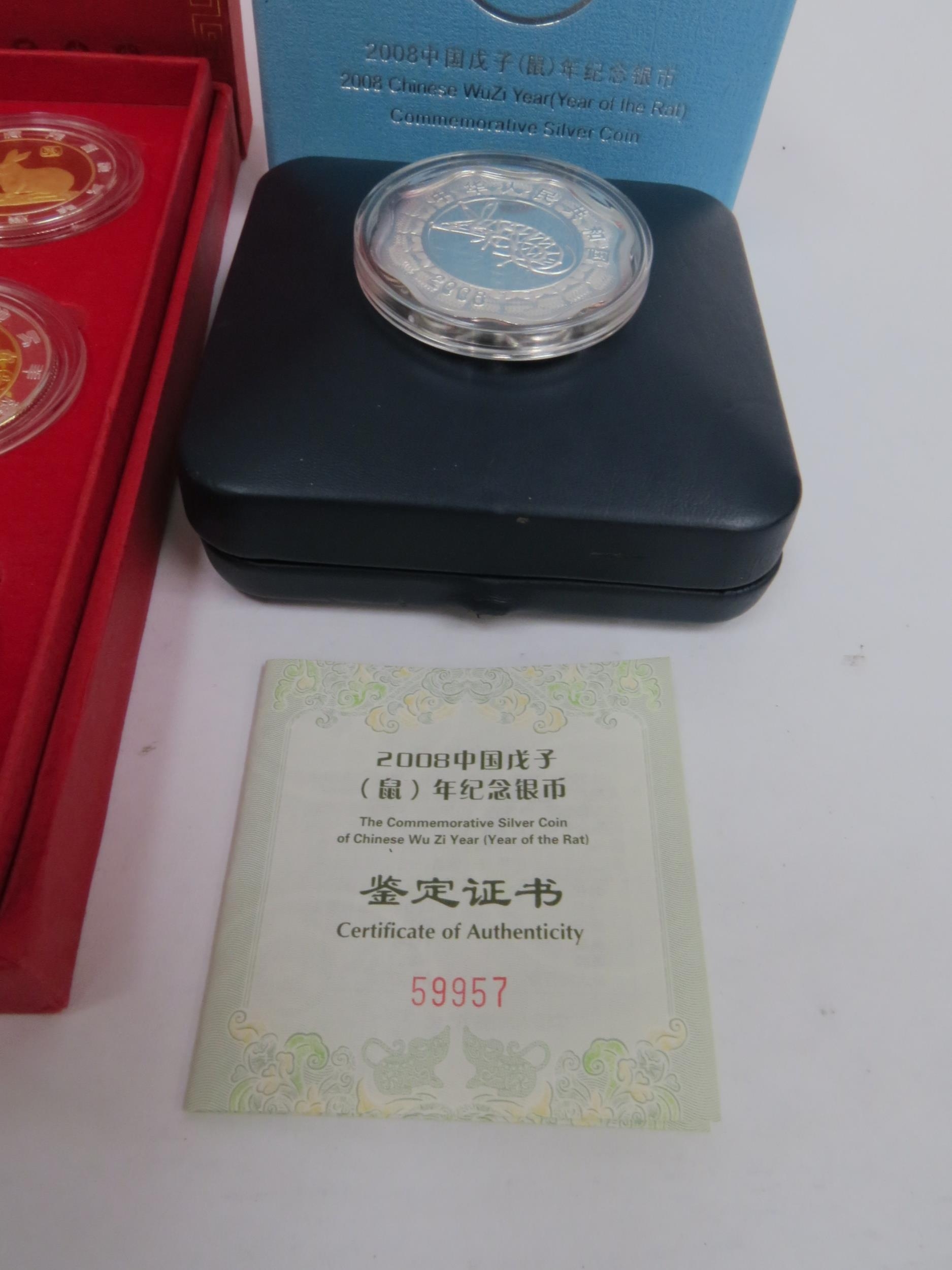 A China Money Stamp Company boxed set of 12 China Animal coins plated in silver and gold with - Image 3 of 4