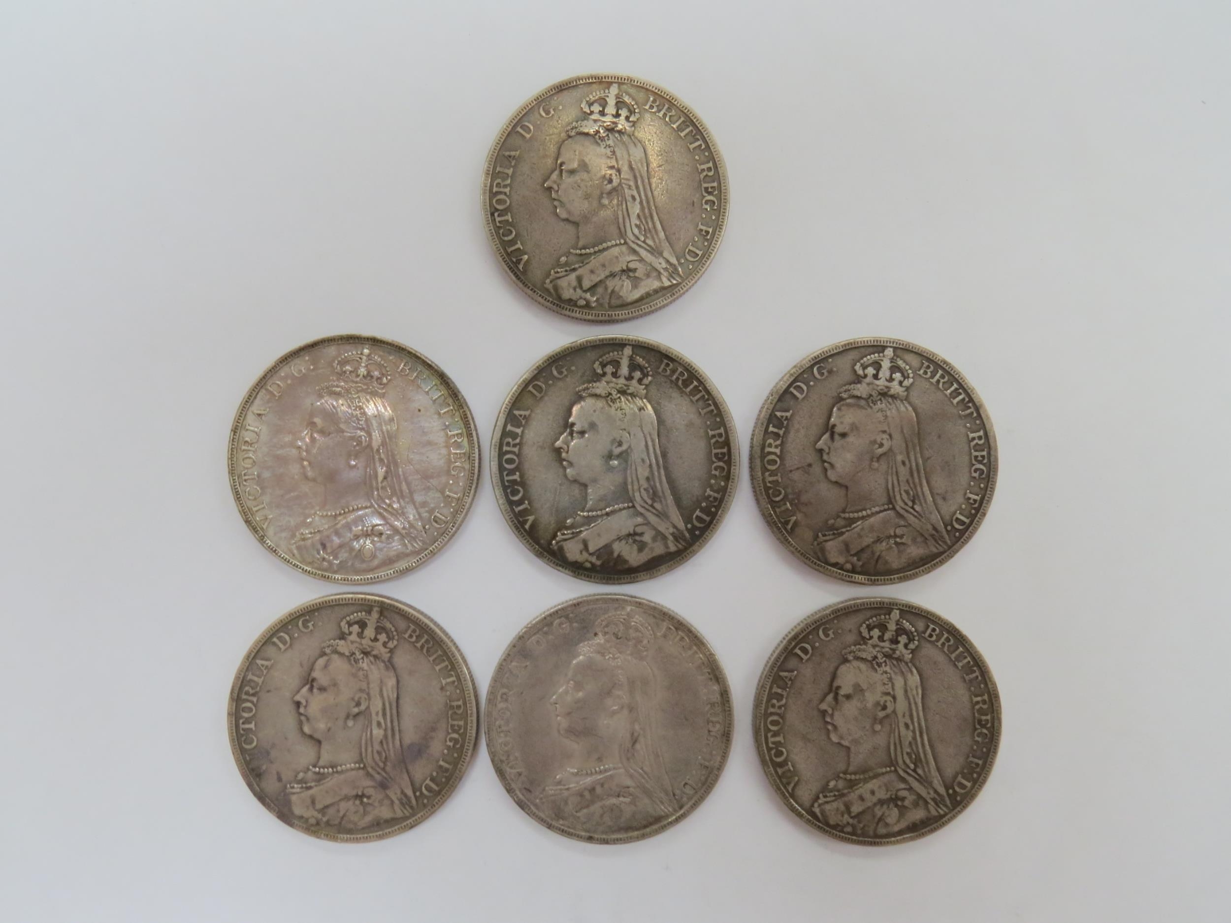 Victoria (1837-1901): Seven 1889/90 Jubilee head crowns, all poor - F grades