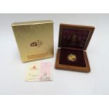 A Beijing 2008 XXIX Olympiad Gold coin, 1/3oz 150 Yuan, with certificate and boxes