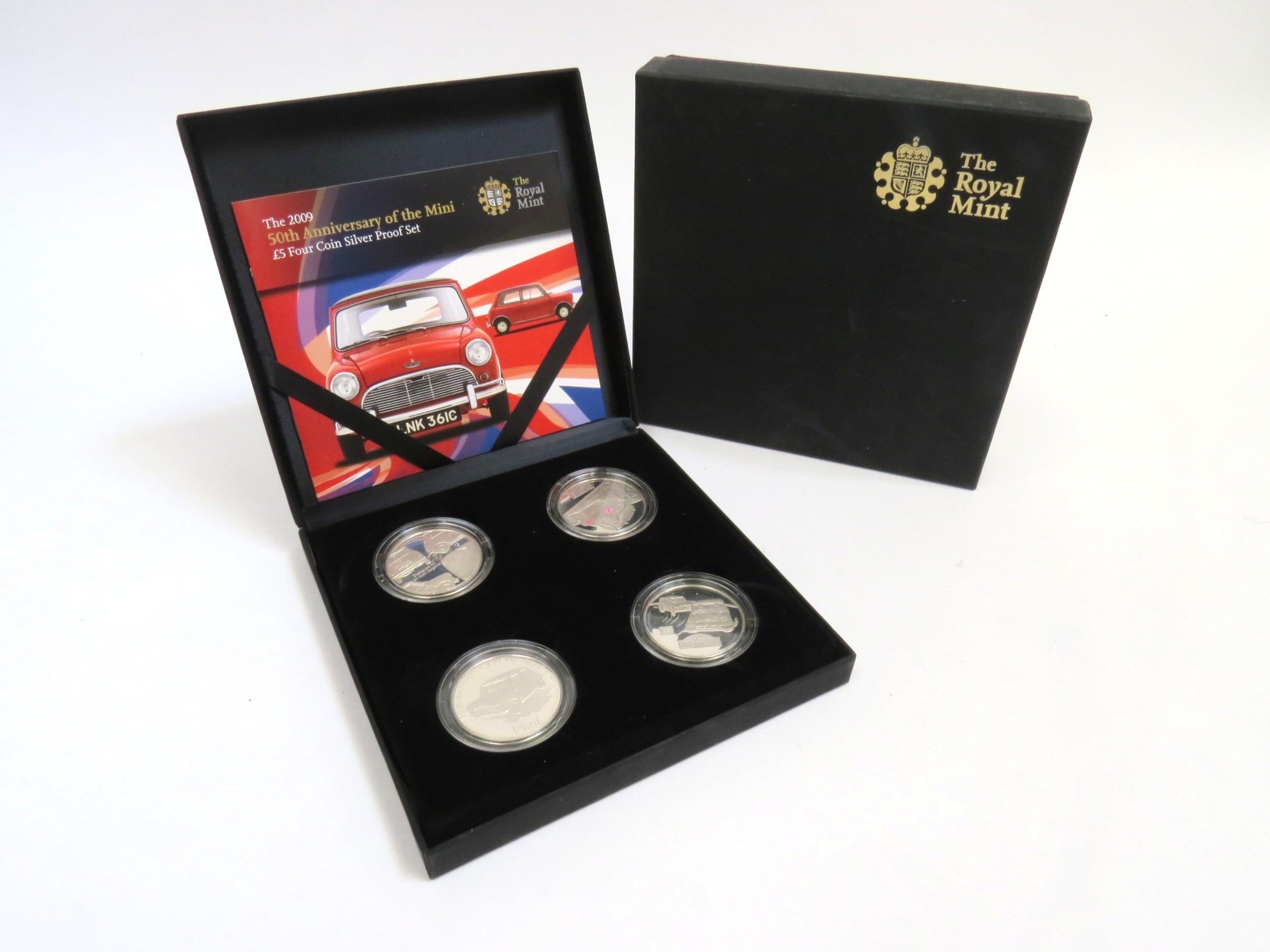 A Royal Mint 2009 50th Anniversary of the Mini £5 four coin silver proof set with certificate and