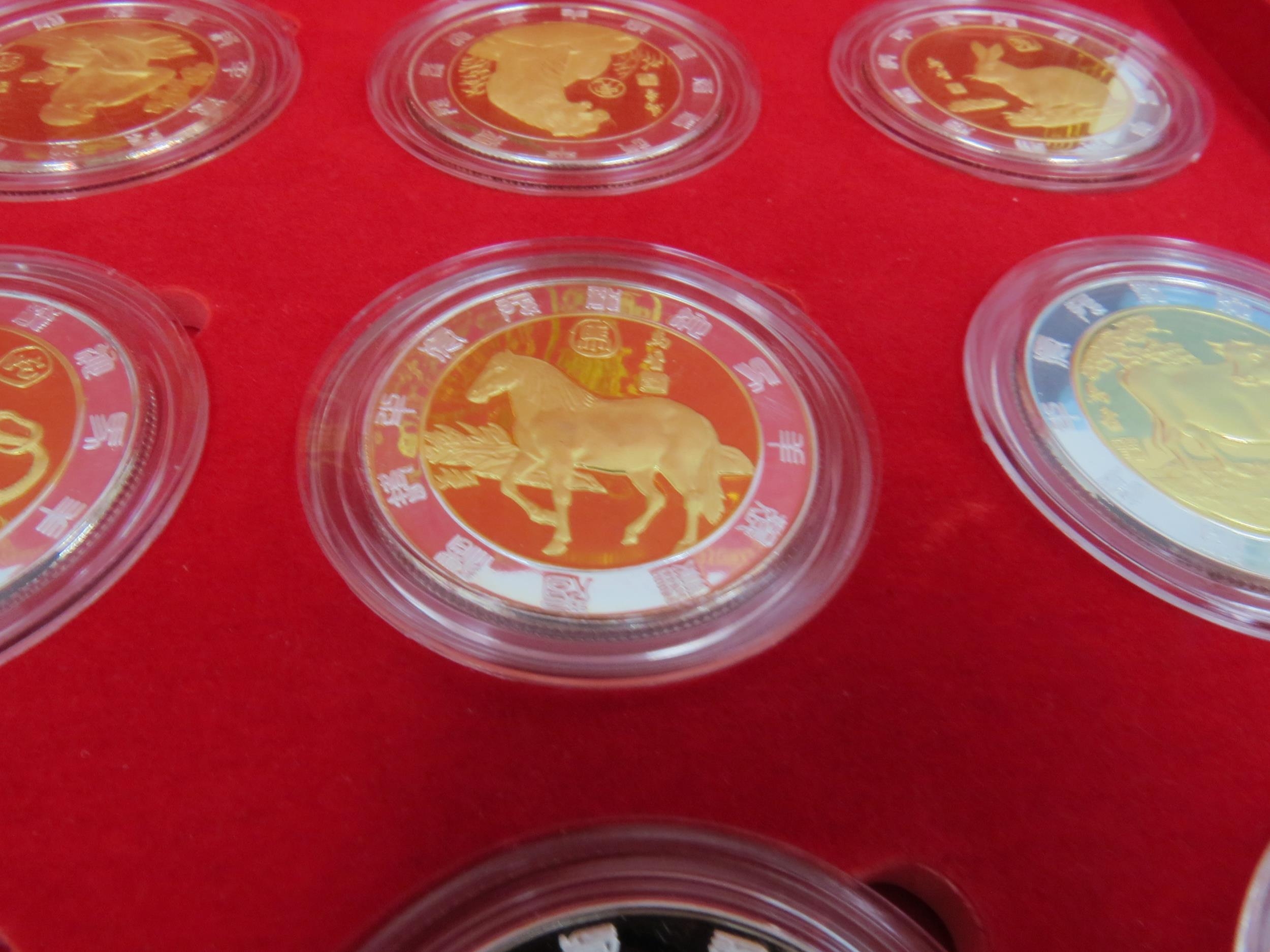 A China Money Stamp Company boxed set of 12 China Animal coins plated in silver and gold with - Image 4 of 4