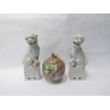 A pair of dogs of fo (25cm high) together with an Oriental lidded ginger jar decorated in famille