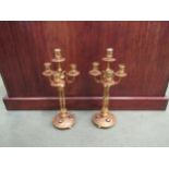 A pair of Victorian gilt brass four sconce candelabra, cabochon detail to base, 39cm high