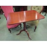 A Circa 1840 mahogany tilt top wine table on a baluster turned column and tripod base