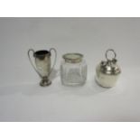 A white metal cruet pot, silver miniature Norwich School trophy and a silver topped dressing pot